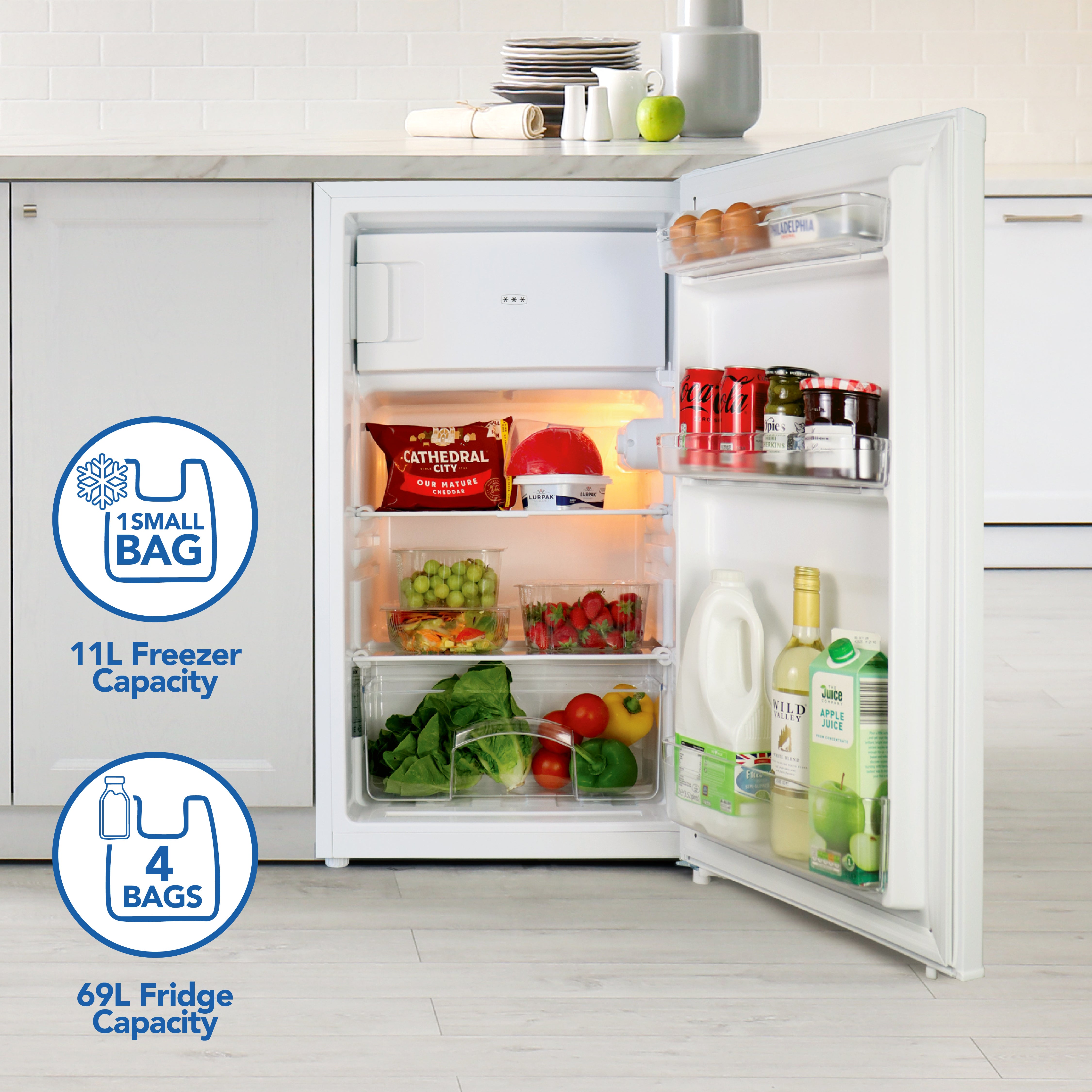 The Igenix Under Counter Fridge with Ice Box (81L, White) features an 11L freezer for one small bag, a 69L fridge for four bags, organized storage, and reversible doors for flexible placement.