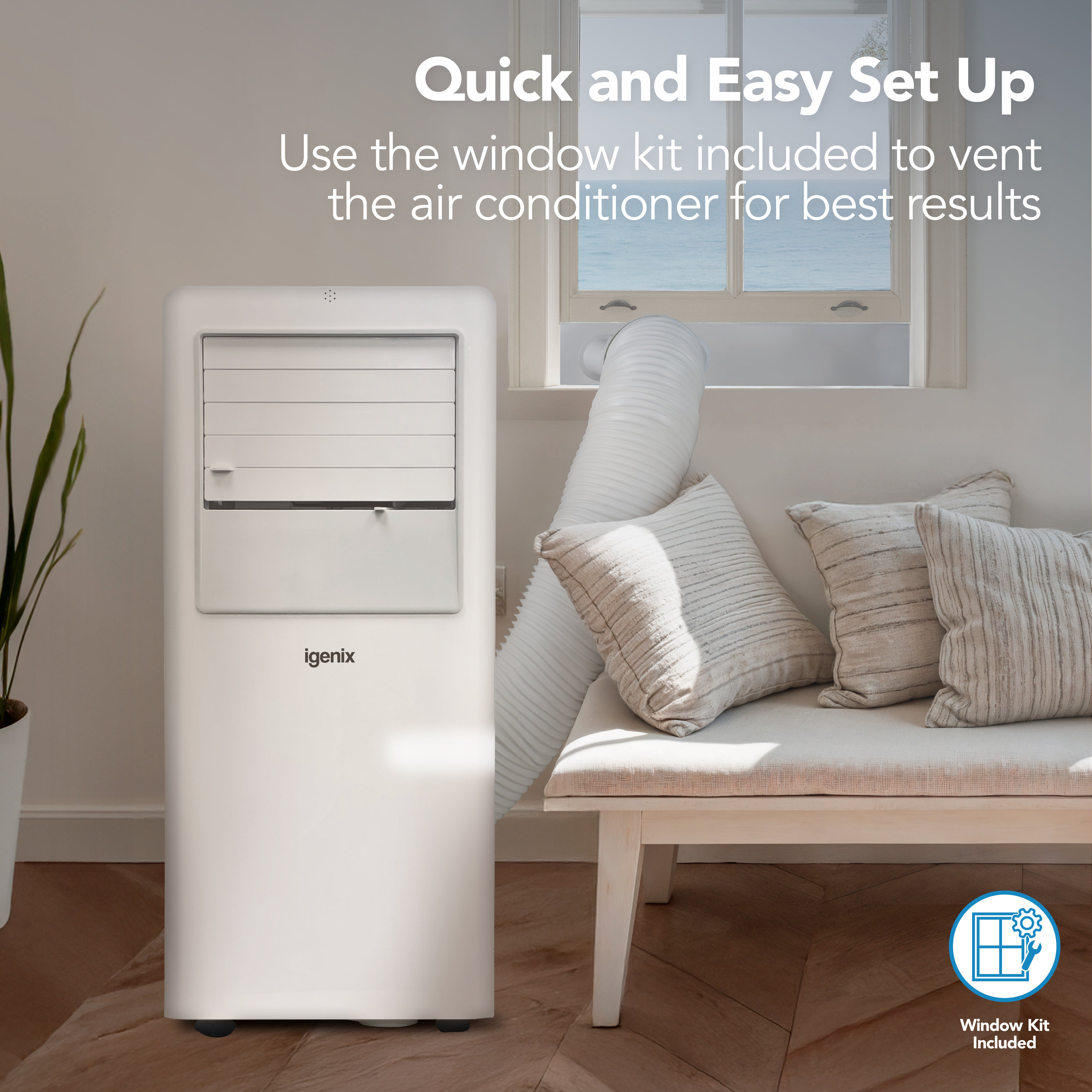 In a bright living room with a beige sofa, the Igenix 3-in-1 Portable Air Conditioner (Cooling, Fan & Dehumidifier, 7000 BTU) is set up with its vent hose connected to the included window kit. Text: Quick and Easy Set Up. Use the supplied window kit to vent your Igenix 7000BTU air conditioner for optimal results.