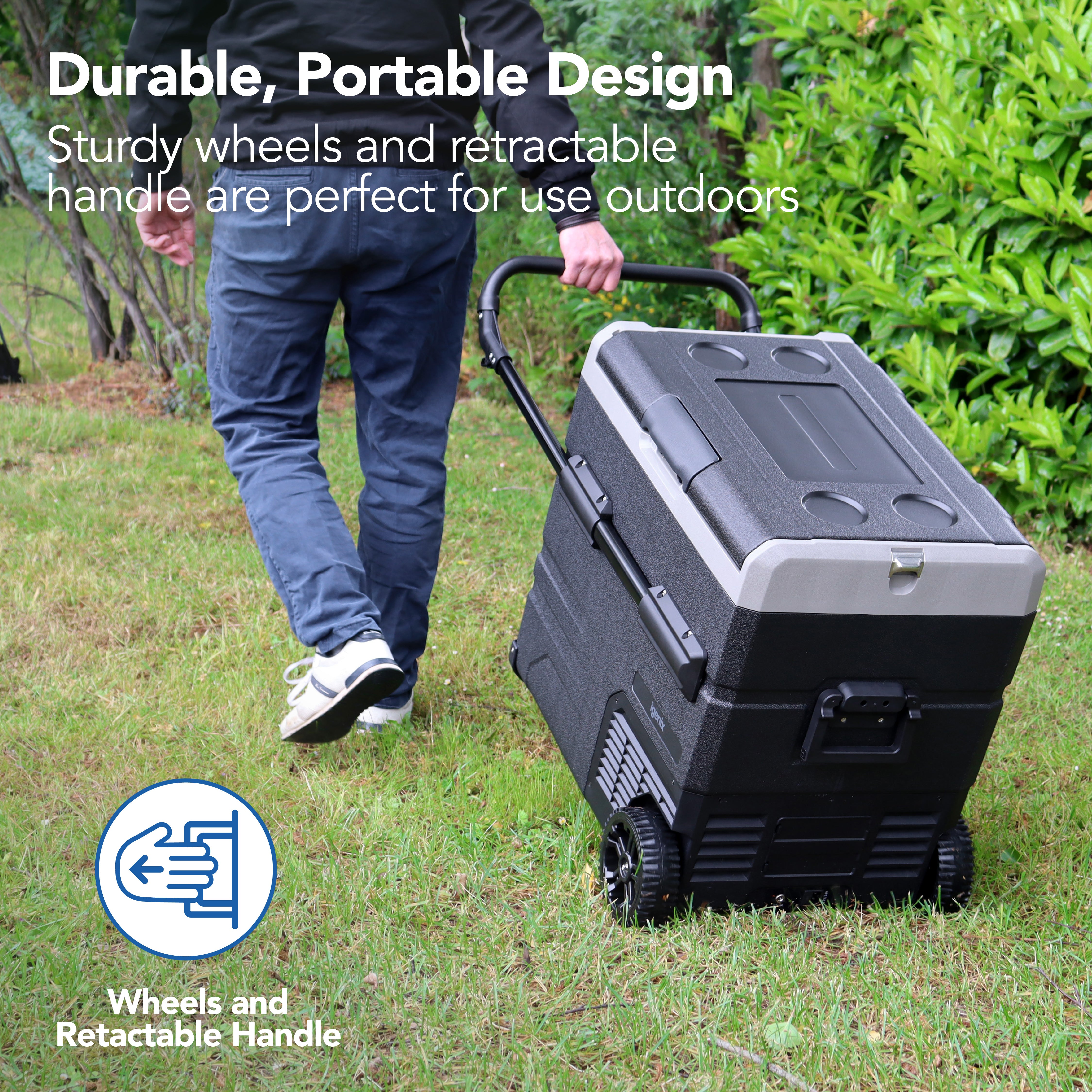 A person pulls the Igenix 60L Portable Fridge Freezer, Black, with a retractable handle across a grassy yard. The text highlights its durable, portable design for outdoor use. A blue icon shows a hand using the handle.