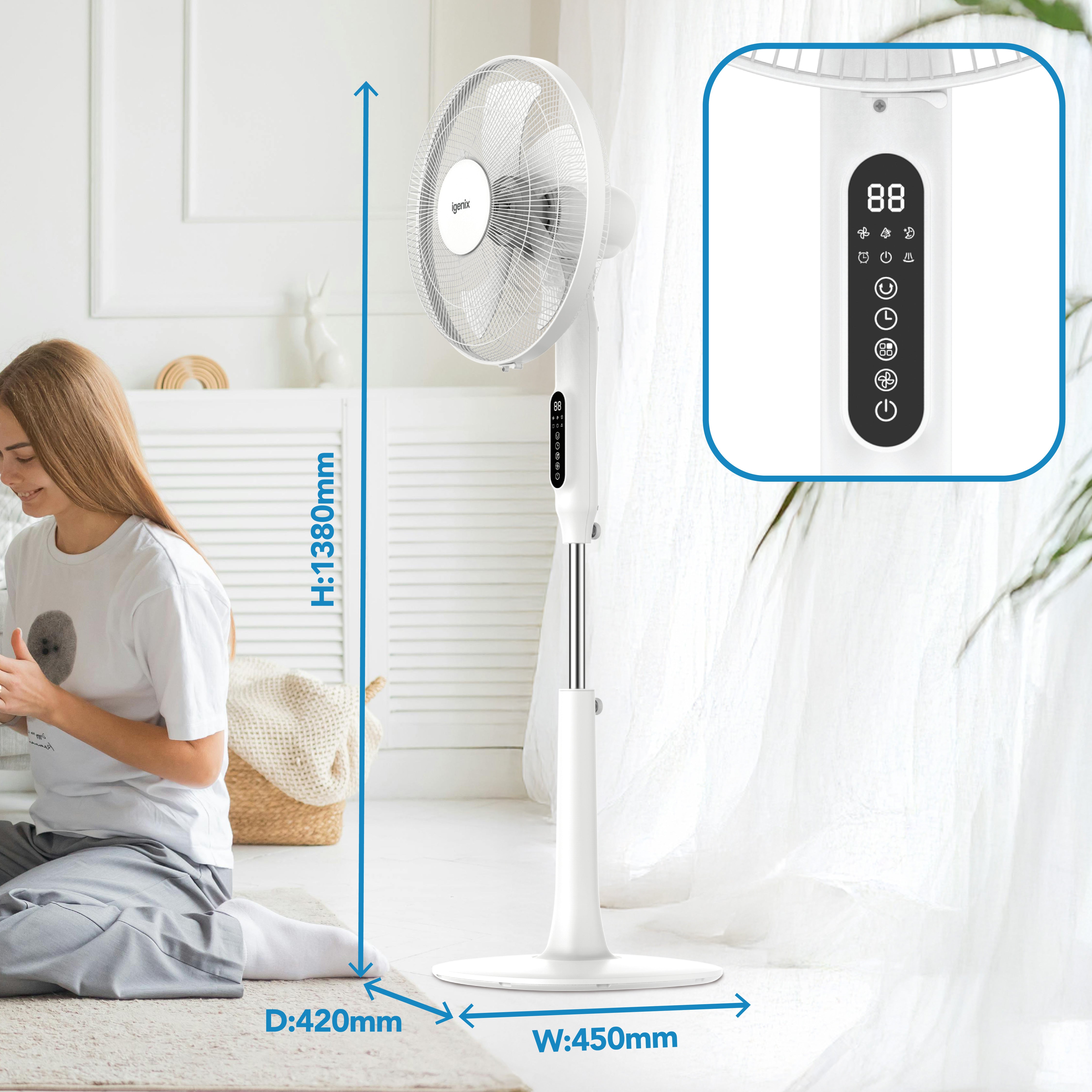 A woman sits on the floor next to an Igenix Digital Pedestal Fan in white (H: 1380mm, D: 420mm, W: 450mm), with a close-up of its digital control panel shown in an inset.