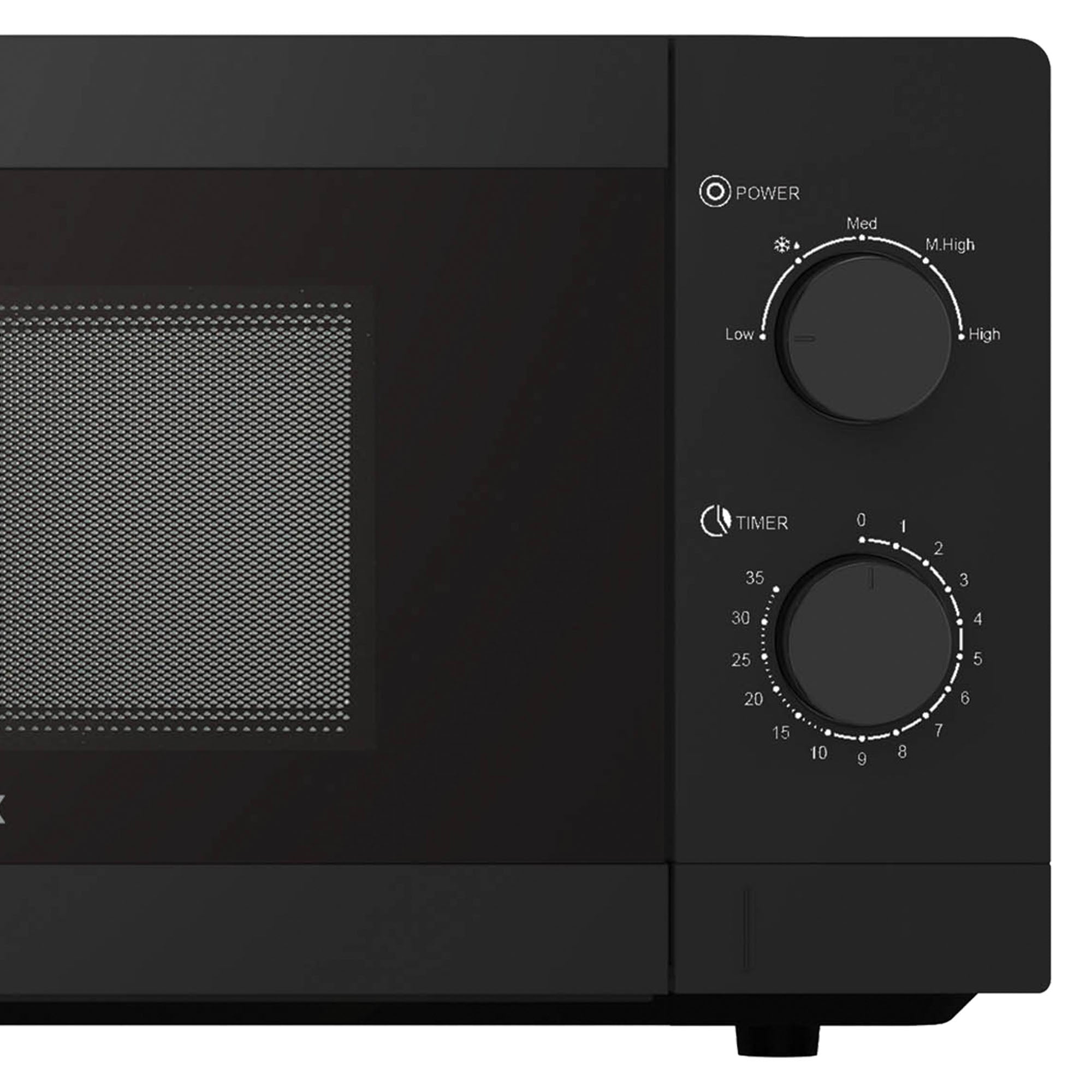 A close-up of the Igenix IGMS08080B Manual Microwave, 20 Litre, 800W in black shows two dials for timer and 5 power settings beside the mesh-covered window on its door.